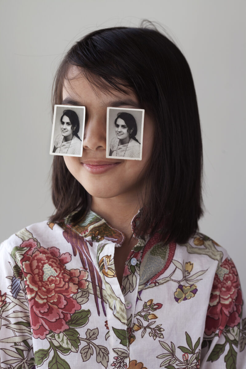 Image of child in foreground with two black and white images over their eyes.